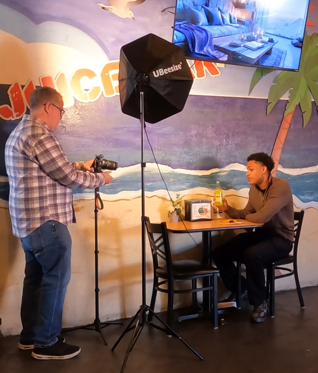Eric filming content inside a restaurant